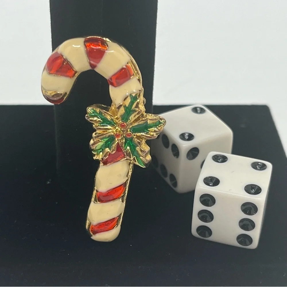 Vintage candy cane pin. Costume Jewelry Enamel, red and white green holly.